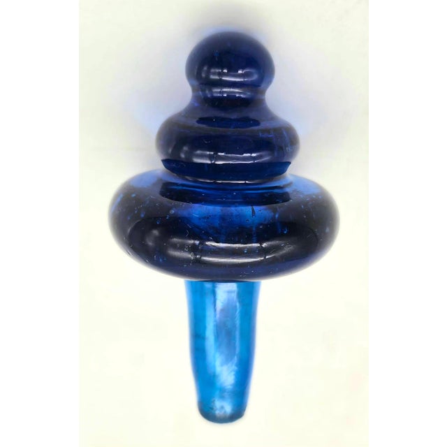 Offered is a vintage mid 20th Century cobalt blue decanter bottle stopper. Its origin is unknown, although it is likely...