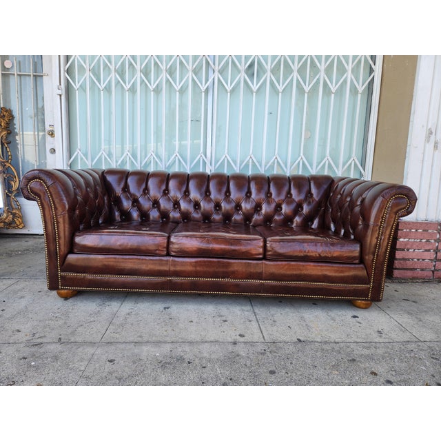 beautiful Vintage Leather Chesterfield Sofa With bottoms around is very comfortable