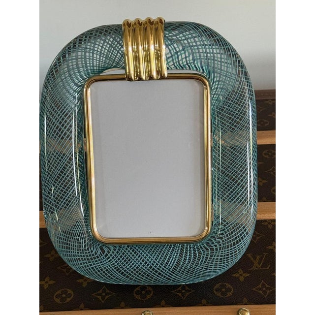 This magnificent vertical photo frame is purely in the tradition of Venetian glassmaking. The technique used to achieve...