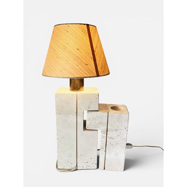 Splendid travertine sculptural table lamp by Fratelli Mannelli. The lamp consists of two travertine elements, one of which...