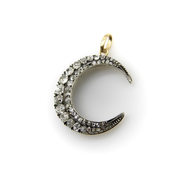 This early Victorian crescent moon pendant has so many lovely details that it is a joy to look at. The first thing you’ll...