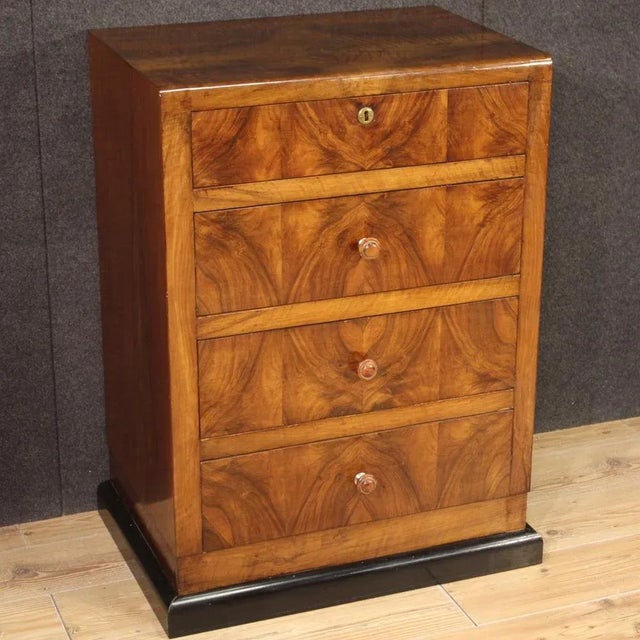 Elegant Italian chest of drawers from the mid-20th century. Art Deco style furniture with ebonized wooden base and body...