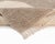 Sophisticated, Hand-knotted wool rug in muted Taupe with contrasting Ivory geometric accents, creating a minimalist yet...