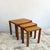 Set of three teak nesting tables by Salling Stolefabrik, featuring slim curved legs and solid teak construction. The...