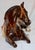 This is a tranquil horse at rest made by the Louisville Stoneware Co. of Kentucky. He is made of ceramic and has been...