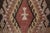 This vintage 2x3 Turkish gift-size rug, circa 1950–1959, features a pair of geometric medallions rendered in rose, ivory,...