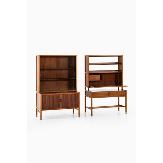 Pair of cabinets in walnut, brass and glass by carl-axel acking, 1950's additional information: material: walnut, brass...