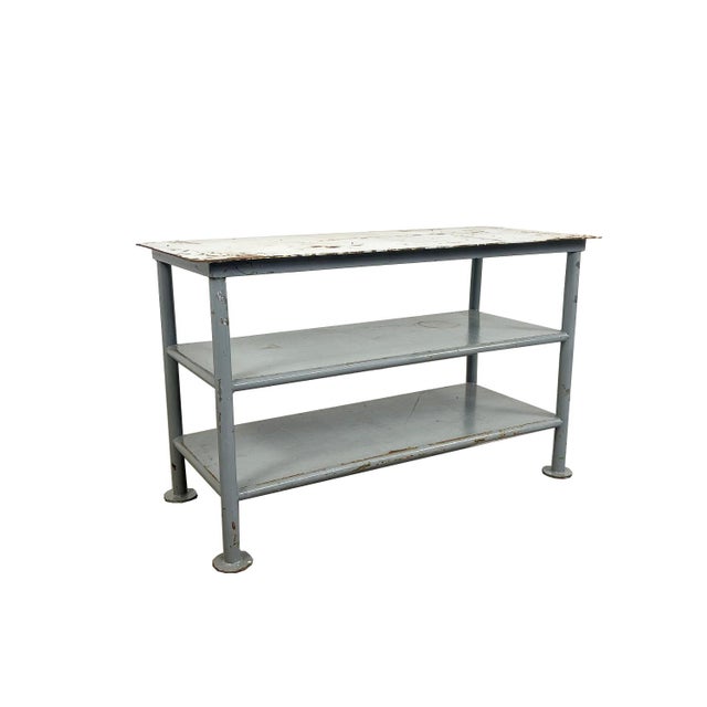 Vintage Industrial Metal Work Table – Three-Tier Steel Shelving Unit This authentic vintage industrial work table is a...