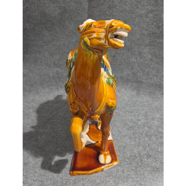Bring timeless elegance and history-inspired artistry to your home with this striking Chinese Tang Sancai-style ceramic...