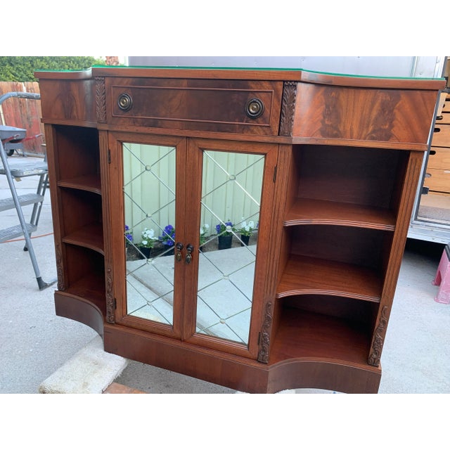 Here we have a very pretty vintage 1940's Neoclassical Mahogany Console Cabinet. Super stylish storage and display for...