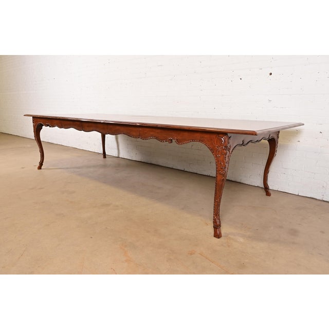 A gorgeous French Country or French Provincial Louis XV style extension dining table By Baker Furniture USA, Circa 1980s...