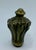 A heavy, solid cast bronze finial with a flared foliate (leaf) motif and a classic pointed cap. Sourced from a Paris flea...