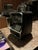 Electronic ATM-style savings bank for kids in black and silver. Designed like a miniature ATM, this interactive money bank...