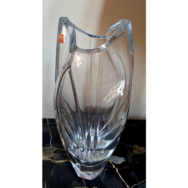 This is a Baccarat crystal vase, specifically the "Giverny" model designed by Robert Rigot.The vase features a distinctive...