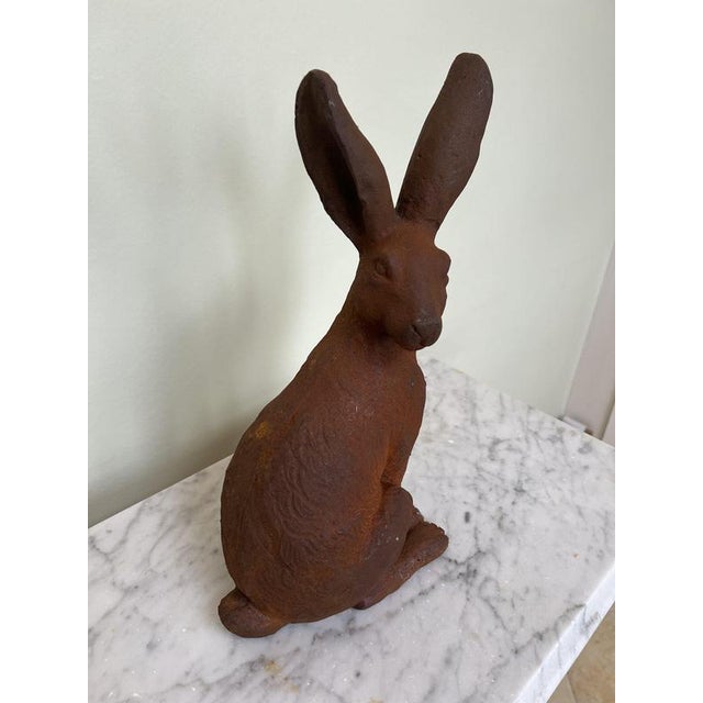 Cast iron model of a wild hare looking over its shoulder
