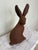 Cast iron model of a wild hare looking over its shoulder