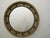 An English turn of the century silver leaf convex bullseye mirror from the early 20th century, with ebonized accents and...