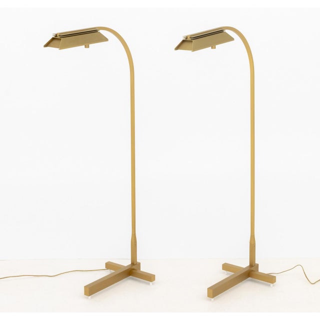 Pair of Casella Lighting Brushed Brass Adjustable Floor Lamps, labels to undersides. 43" H x 18" W x 10" D. Provenance:...