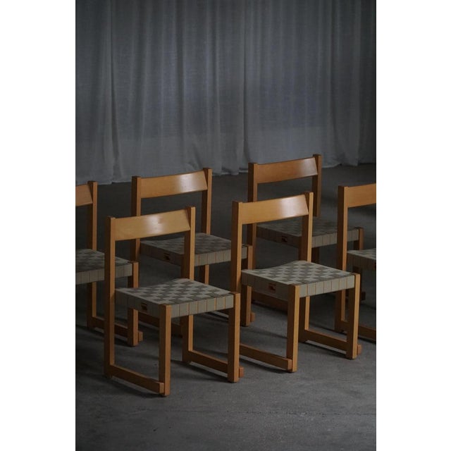 Crafted in beech with a woven seat, this set of 6 hans j. Wegner ‘koldinghus’ chairs embodies the refined simplicity and...