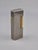 The product is a rare vintage Dunhill coral gas lighter with the D logo, featuring a silver and gold design. Made in...