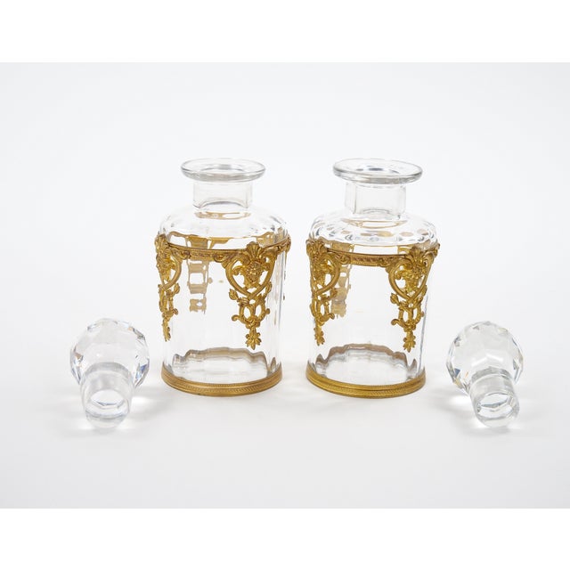 An elegant pair of antique French glass vanity or perfume bottles, dating to the mid-to-late 19th century and attributed...