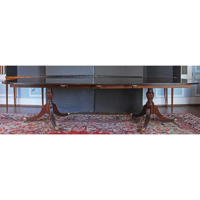 Hand-crafted double pedestal dining table, circa 1970s by Scholte Company, Atlanta. Raised on double pedestals with...