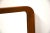 A mid century modern teak framed mirror with rounded sides made in Denmark.