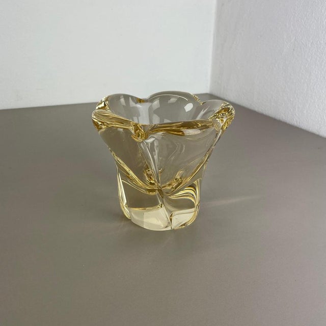 Wonderful heavy glass element designed and produced by DAUM in France in the 1970s. This glass bowl is high quality French...