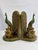A striking pair of vintage peacock bookends featuring rich green tones with brass-toned accents. Each bird is perched on a...