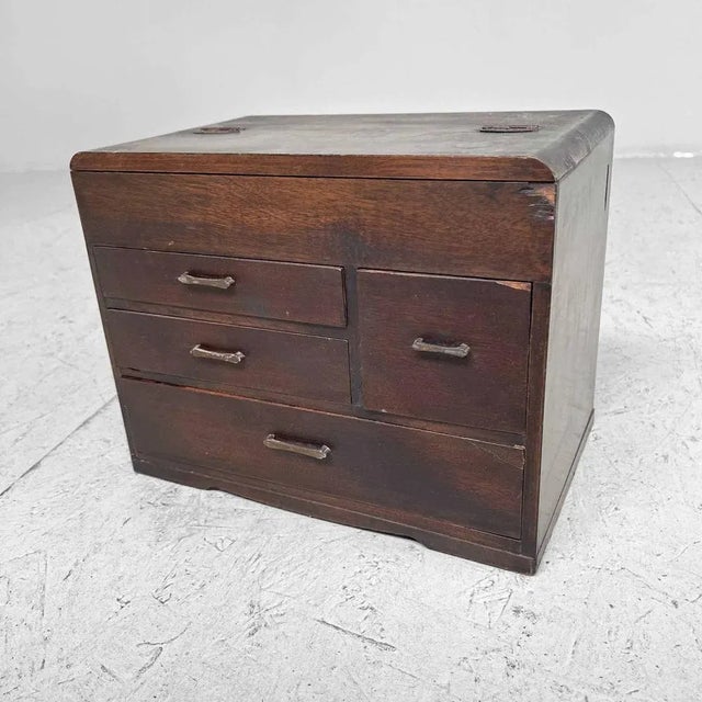 Japanese antique sewing/writing utensil box from the early 1900s. Features four drawers of different sizes and a storage...