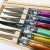 Jean Dubost Laguoile Stainless Steel Steak Knife Set, with multi color handles brand new in wood presentation box.