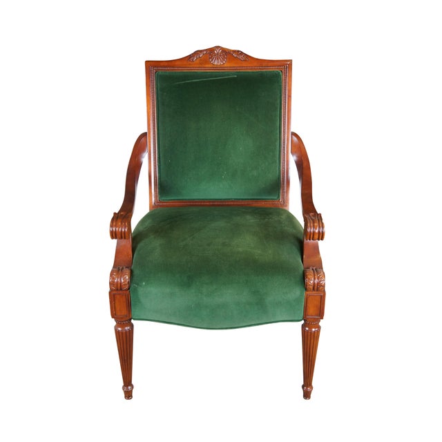Late 20th Century French Empire Style Upholstered Arm Chair. Made from birch with a high back featuring a scalloped crest...