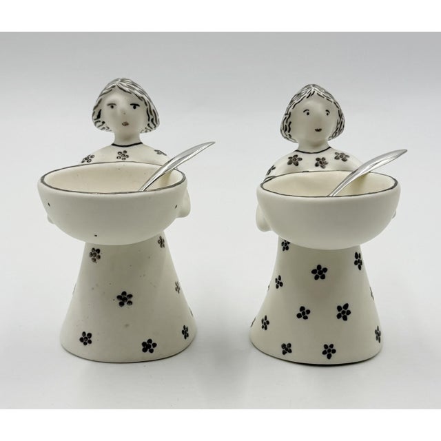 A charming and highly collectible pair of "The Couple" salt cellars designed by celebrated Mexican artist Emilia Castillo...