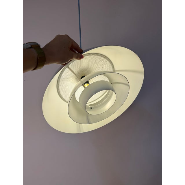An award-winning milestone of Danish lighting design: The white Safari pendant lamp was designed by the renowned design...
