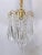 This is a small chandelier with the brass frame and hand polished cut teardrops. It has one Edison based socket that it...