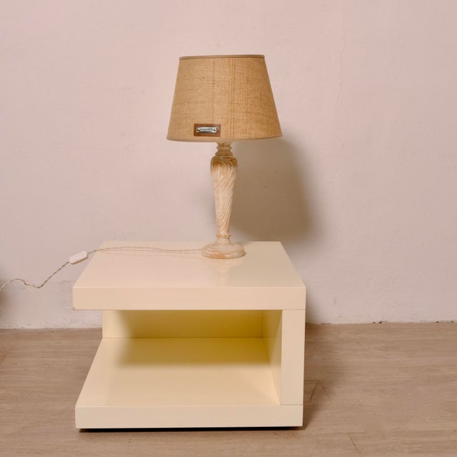 Table lamp, a beautiful furnishing accessory from the Italian luxury brand Brunello Cucinelli. Wooden base and fabric...