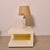 Table lamp, a beautiful furnishing accessory from the Italian luxury brand Brunello Cucinelli. Wooden base and fabric...