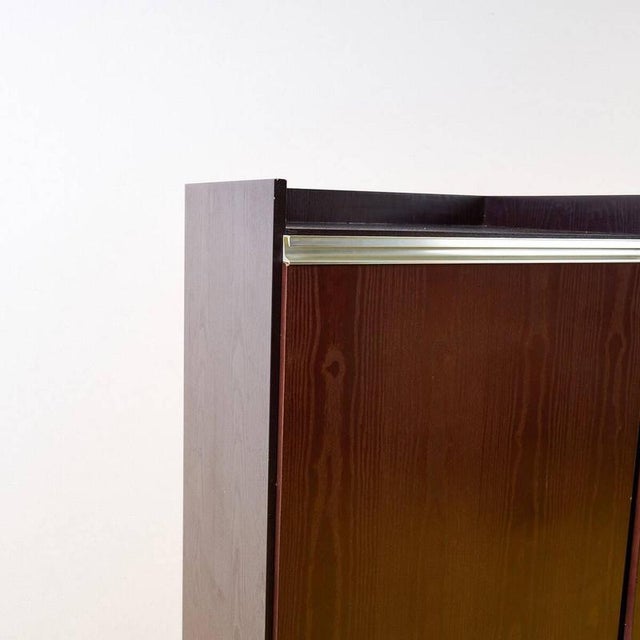 Item : discover this elegant wooden office cabinet, a perfect example of modern design. Featuring a dark brown finish, it...