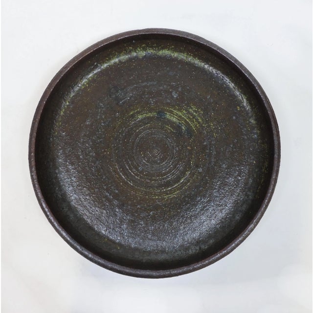 Beautiful and large stoneware charger designed, thrown, and glazed by acclaimed Finnish ceramic artist, Raija Tuumi for...