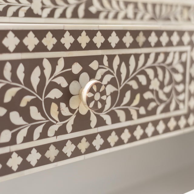 The Arabesque Bone Inlay Four-Drawer Chest combines traditional floral ornamentation with a structured, architectural...