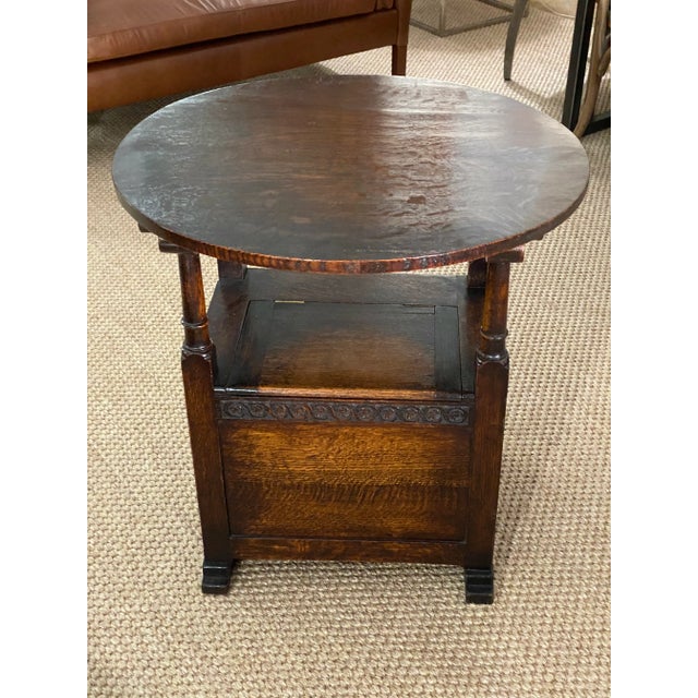 Good patina on this English chair with storage that also becomes a side table. A practical and fun piece with many uses....