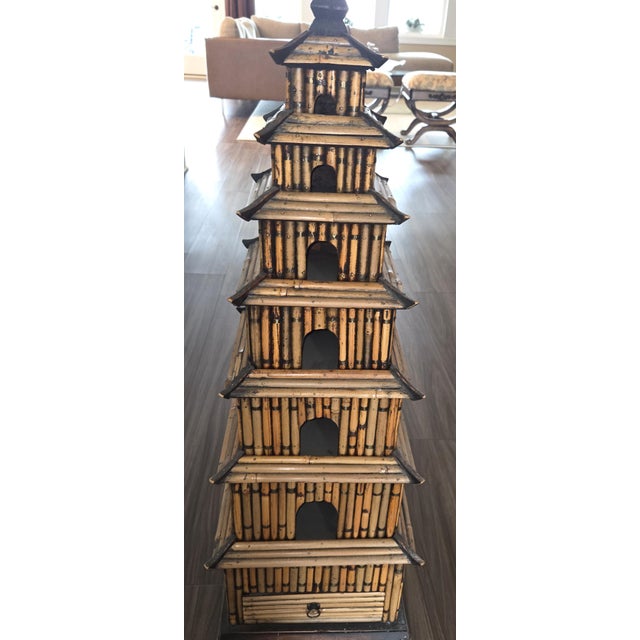 This vintage Pagoda Tower is made using split pencil reed bamboo construction layered over a wooden frame, featuring burnt...