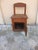 A small chair originally designed as a comfortable chair, later modified into a work chair with a warmer underneath....