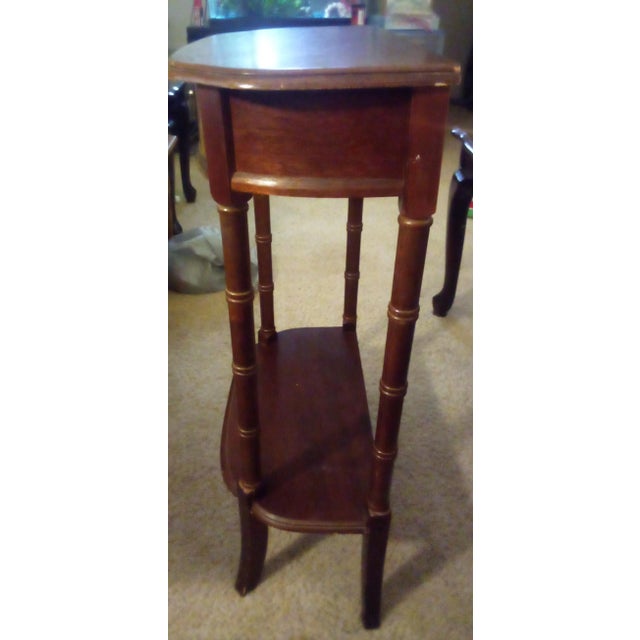 This was hand carved by an unnamed Craftsman during the Ming and Qing dynasties. This table has a lower shelf for a...