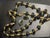 This vintage 1980s–1990s Trifari demi-parure pairs a long, dramatic bead necklace with matching post-back stud earrings in...