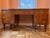 Art Deco Tanker desk with glass topper. 2 side cabinets and middle drawer. All lock with a key included. Desk is in good...
