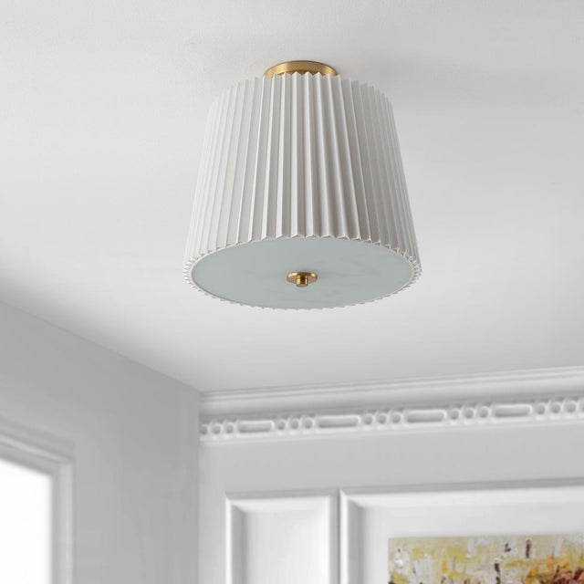 Introducing MADIO, a sophisticated 3 light flush mount that brings elegance and charm to any space. Designed with a 16...