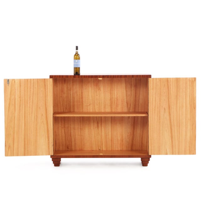 A beautiful contemporary cabinet in the manner of Jean-Michel Frank. This Art Deco-inspired wooden cabinet features a...