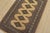 A tribal Bokhara Jaldar rug hand-knotted with fine wool on a cotton foundation. This rug features geometric medallions set...