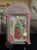 This vintage Mexican nicho shrine is a mixed-media devotional work assembled from metal, paper, and applied decorative...